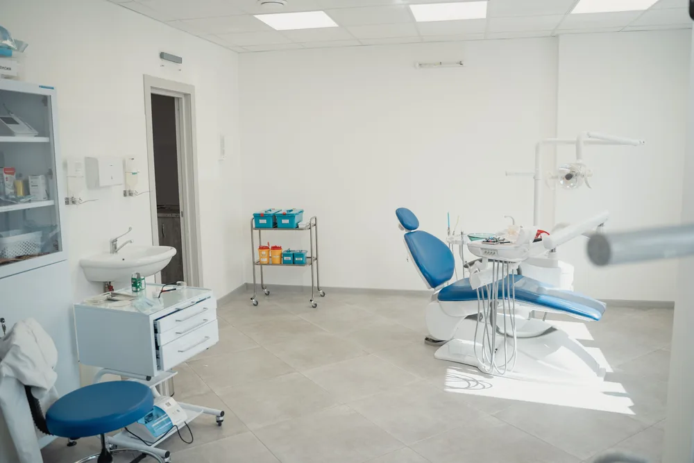 Clean, bright dental treatment room with a patient chair
